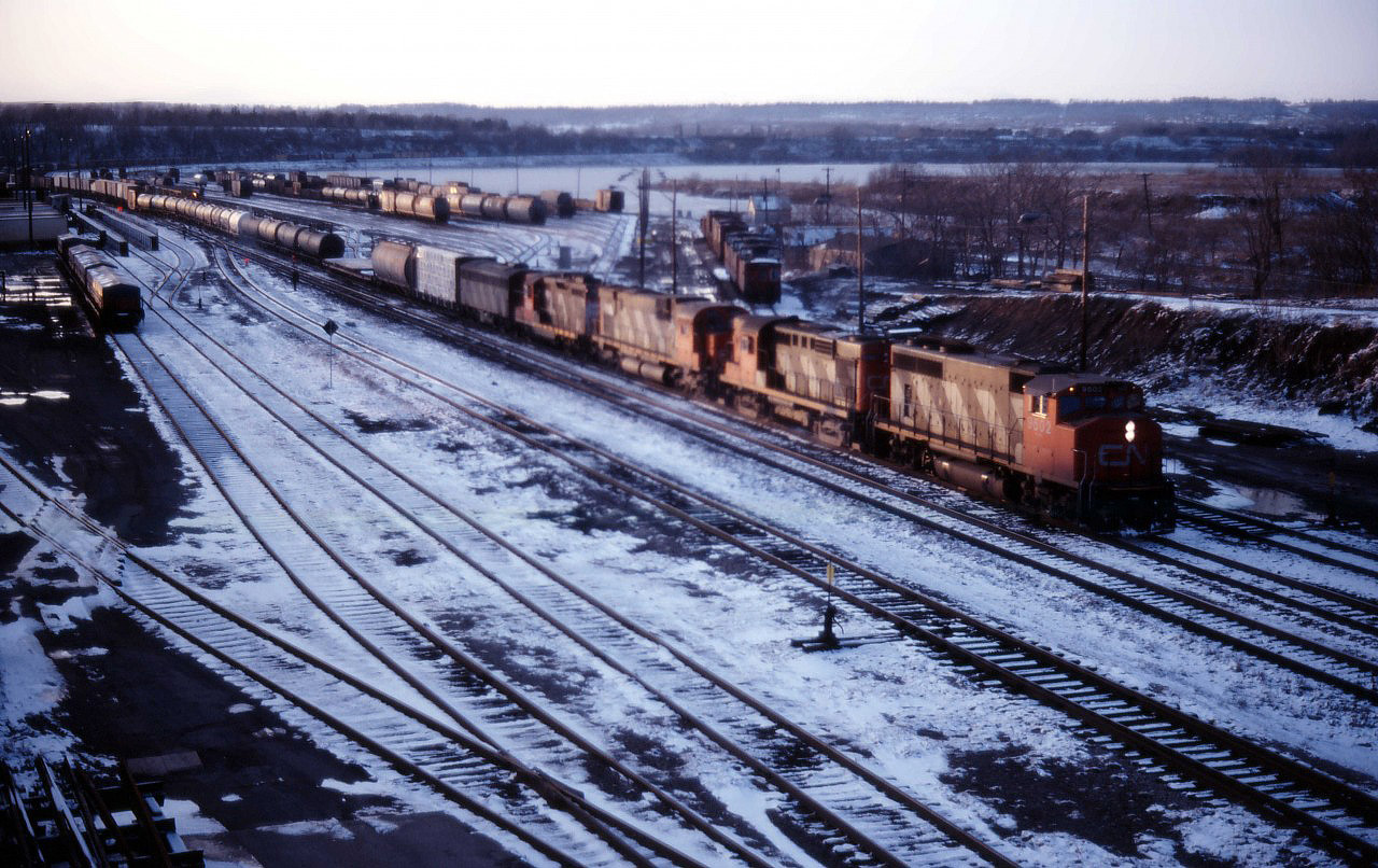 The light is rapidly fading on this December afternoon, but at least there is still enough of it for one last shot--and it will be a good one! What is likely Fort Erie bound train 433 works Hamilton Yard with another great 1980s consist CN GP40-2LW 9502, an unidentified RS18, C630m 2030, GP9 4525, and F7Bu 9195.