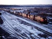 The light is rapidly fading on this December afternoon, but at least there is still enough of it for one last shot--and it will be a good one! What is likely Fort Erie bound train 433 works Hamilton Yard with another great 1980s consist CN GP40-2LW 9502, an unidentified RS18, C630m 2030, GP9 4525, and F7Bu 9195.