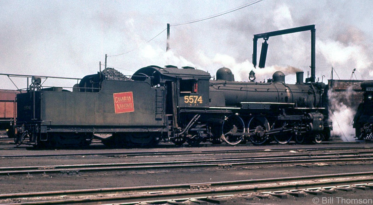 Canadian National 5574, a K3a-class Pacific built by MLW in 1913 for the GTR, sits under steam on the ready tracks near Mimico roundhouse in 1956. As dieselization continued in the mid-late 50's on CN, she would be retired and cut up for scrap late next year (November 1957).