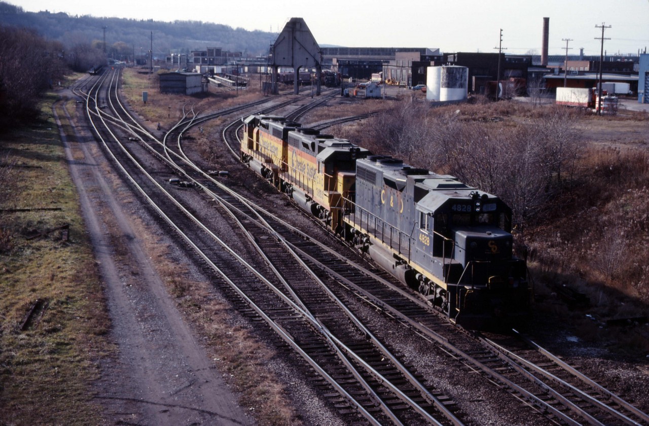 We are on the Chatham Street bridge as a trio of '38s back out of the TH&B roundhouse...likely headed for Aberdeen Yard to pick up the steel train. In the background you can see another leased unit (B&O), a CP Rail unit, at at least a couple of TH&B locomotives. While not classic TH&B, the early years of CP ownership certainly interesting.