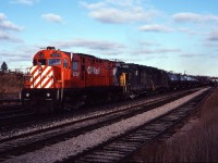 CP 4200, the first C424 on the Canadian Pacific roster, crests the hill at Guelph Jct with C&O GP35 3520 and another GP35 in December 1980.