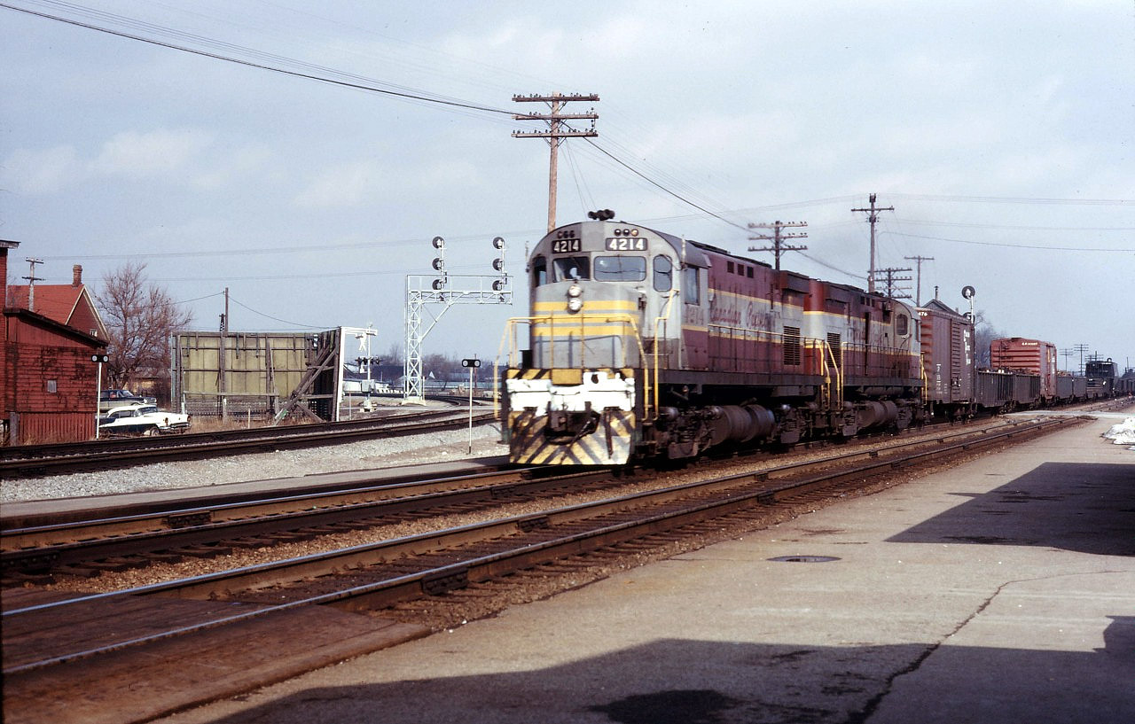 Built in July 1965, C424 4214 is less than a year old as she and a sister bring the Starlight through Burlington operating on CN trackage rights. Note the Brant Street crossing tower just poking above the first car of the train.