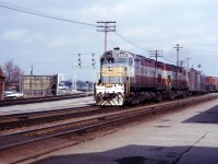 Built in July 1965, C424 4214 is less than a year old as she and a sister bring the Starlight through Burlington operating on CN trackage rights. Note the Brant Street crossing tower just poking above the first car of the train. 
