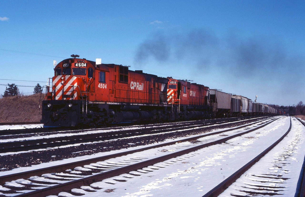 CP 4504 and 4512 lead a westbound through Guelph Jct in early 1980.