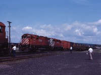 East meets West (eastbound and westbound, that is) meet in North Bay. M630 4570 and SD40 5533 lead the eastbound while a trio of M636s (4722, 4700 and 4734) are in charge of the westbound.