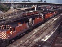 An eastbound prepares to depart Sudbury with an interesting lash-up...GP35s 5016 and 5017, C424 4220, and SD40-2s 5742 and 5706.