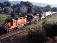 The "Starlight" was a fan favourite--different from the CN trains which dominated the Hamilton area and often having unusual units from TH&B parent CP Rail. Tonight, we see leased N&W SD40-2 1651 assisting a similar CP unit (5728) with TH&B SW9 55 being handled to Toronto Yard for servicing.