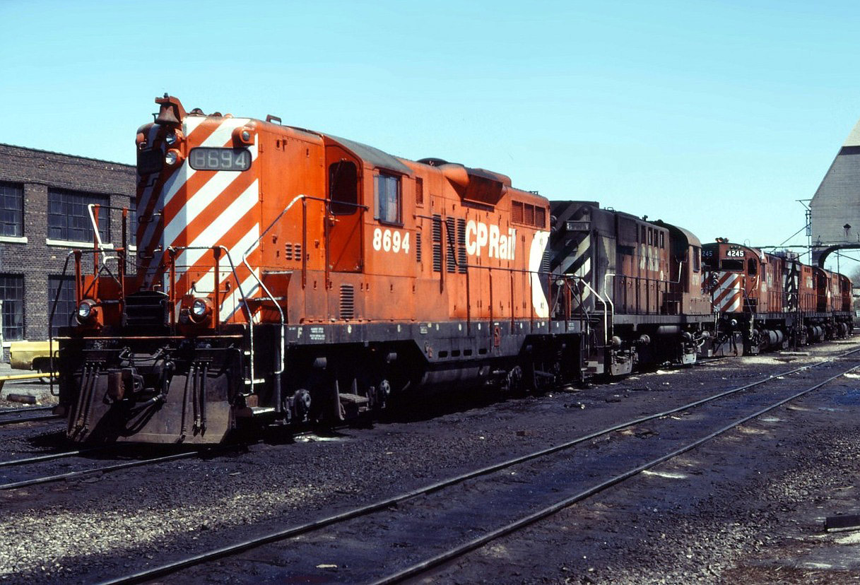 An interesting line up of power at the TH&B Chatham Street roundhouse in Hamilton--CP Rail GP9 8694, RS18 8791, C424 4245, and two other Centuries.