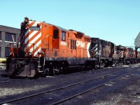 An interesting line up of power at the TH&B Chatham Street roundhouse in Hamilton--CP Rail GP9 8694, RS18 8791, C424 4245, and two other Centuries.