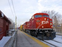 Running about 12 hours later than normal, CP 252 is passing Lasalle Station with repainted CP 9715 leading CP 9375. The station at left is still used by CP employees.