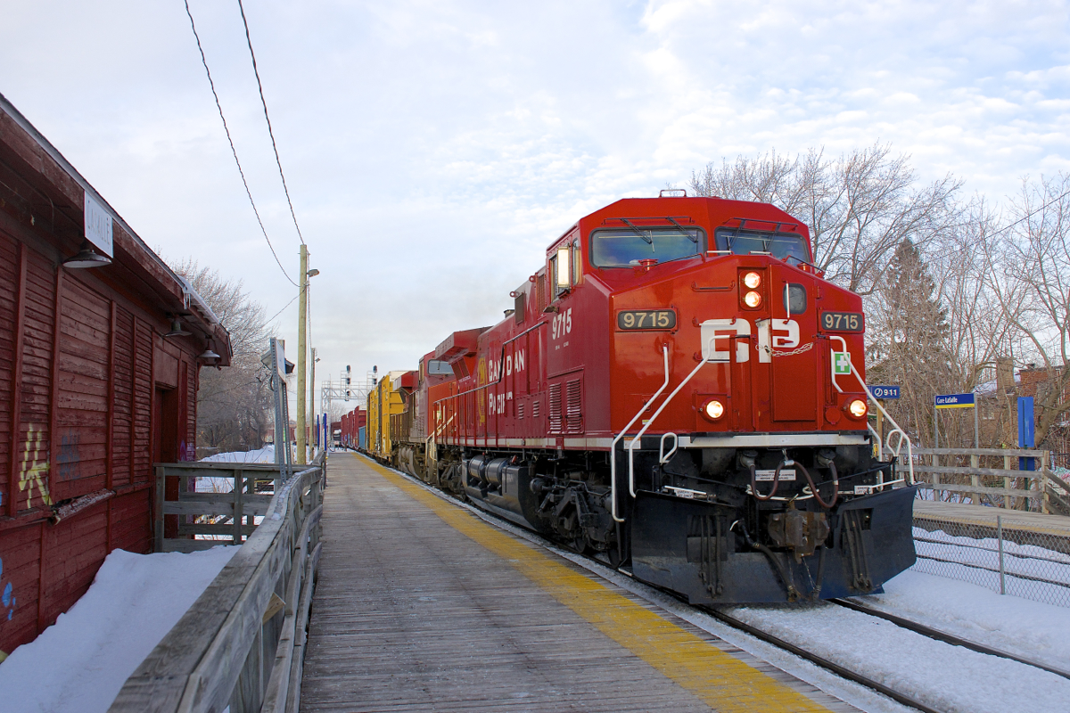 Running about 12 hours later than normal, CP 252 is passing Lasalle Station with repainted CP 9715 leading CP 9375. The station at left is still used by CP employees.