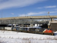 CN 8889 & IC 2455 lead a 128-car CN 310 underneath the soon to be demolished Turcot interchange.