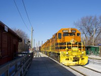 SLR 3004, QGRY 3102, SLR 3008, SLR 3804, SLR 804 lead a 94-car detour SLR 394 past Lasalle Station. The station building at left is still used by CP employees.