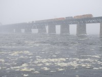 Detour SLR 393 with SLR 3805, SLR 805, QGRY 6904, SLR 3035 & QGRY 3105 for power is crossing the St. Lawrence River on a snowy morning.