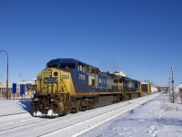 CSXT 7915 & CSXT 3470 (built by GE 24 years apart) lead an 88-car CN 327 past the stations at Dorval on a frigid but sunny afternoon.