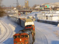 it's about fourty minutes before sunset as CN 2407 leads a short version of CN 401 (just 43 cars in tow) as it passes through Turcot West. 