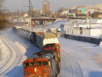 it's about fourty minutes before sunset as CN 2407 leads a short version of CN 401 (just 43 cars in tow) as it passes through Turcot West. 