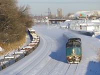VIA 6431 leads VIA 67, which is passing a cut of baretales on CN 543.