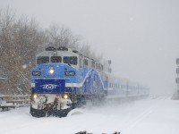 With the snow falling heavily, ex-GO Transit F59PH AMT 1346 leads AMT 86 onto the island of Montreal and towards its stop at Lasalle Station.