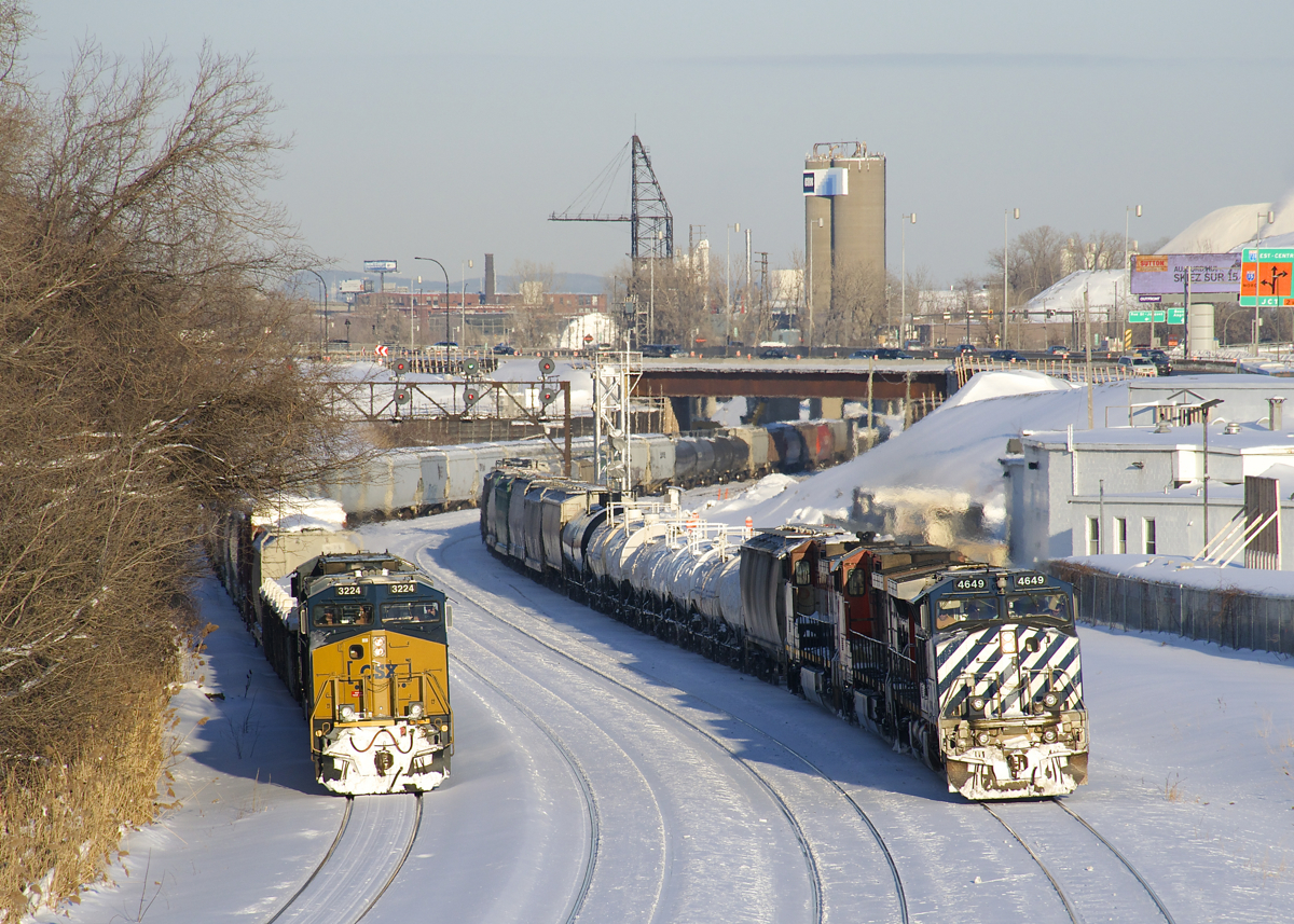 Lucky timing. I couldn't have gotten any luckier with my timing here, as CN 543 at left (with CSXT 3224 & CSX 468 for power) is backing up at Turcot West, just as CN 323 passes at right, with BCOL 4649, CN 2599, BCOL 4643 and only 22 cars.