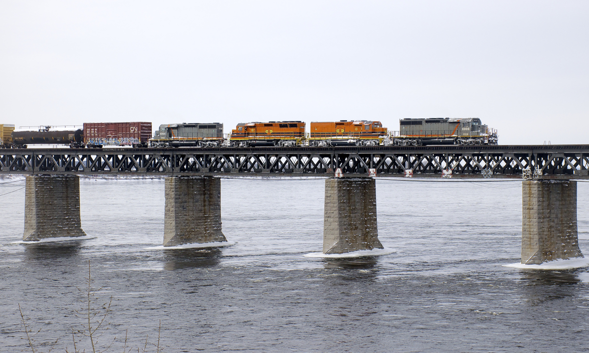Detour SLR 393 has two QGRY SD40-3's (QGRY 6908 & QGRY 6904) sandwiching two SLR units (SLR 805 & SLR 3805) as it crosses the St. Lawrence River, nearly onto the island of Montreal.