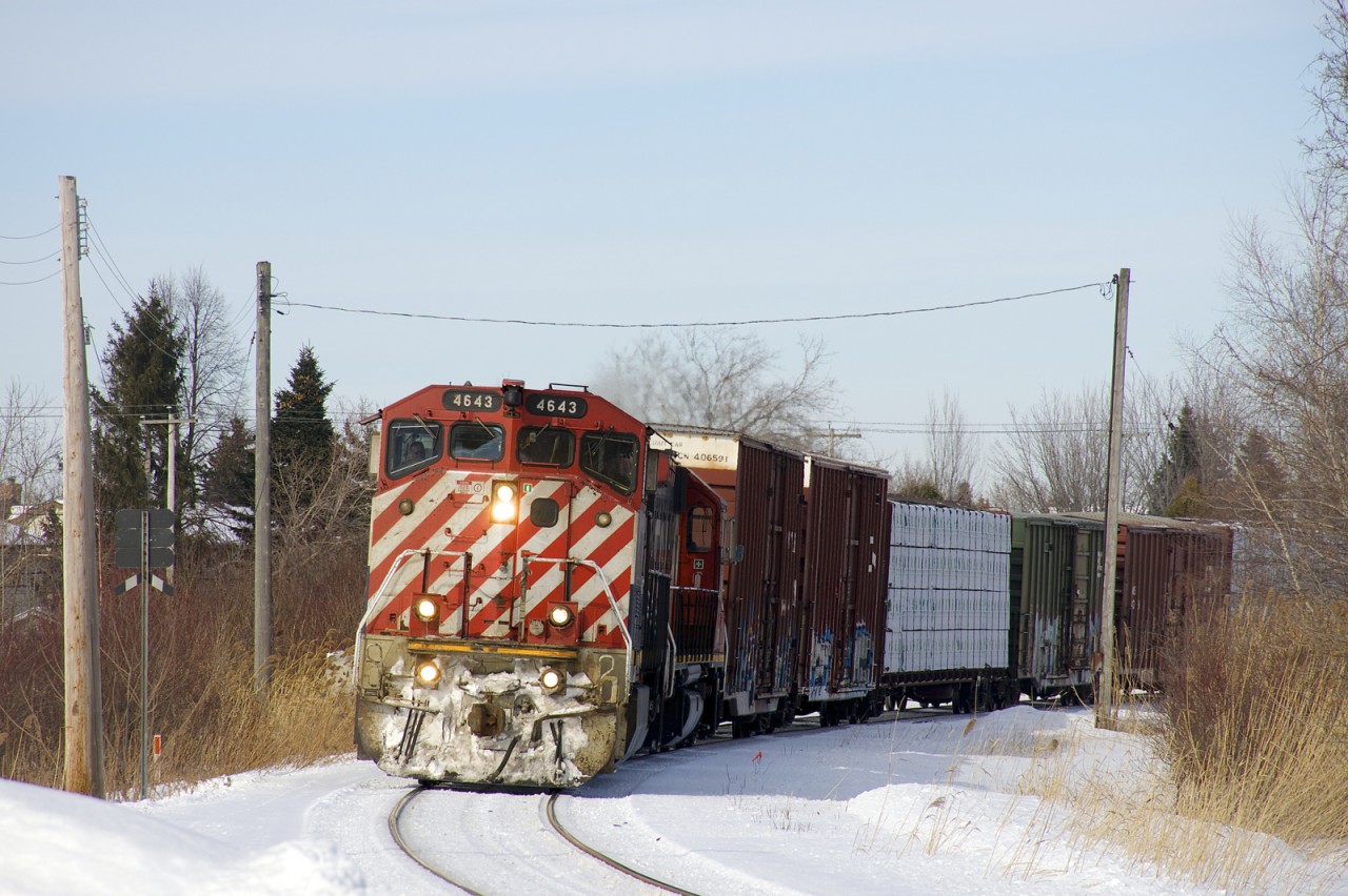 A rare BCOL Dash9-44CWL (BCOL 4643) leads a 54-car CN 324 around a curve in Brossard near MP 36 of CN's Rouses Point Sub. Trailing is GTW 4900 on this train destined for St. Albans, VT and interchange with the NECR.
