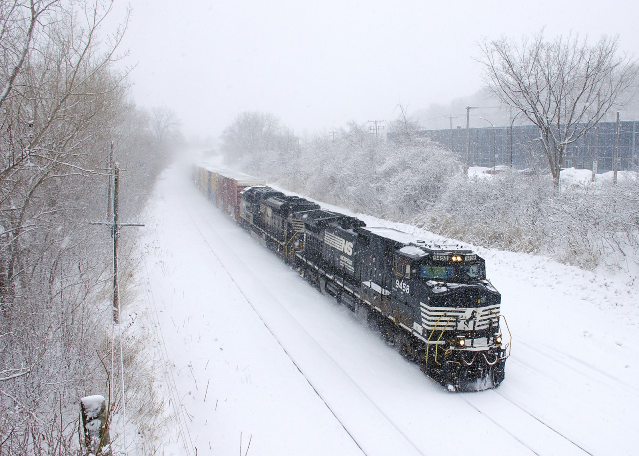 With two units (NS 9458 & NS 1045) and only 38 cars, CN 528 is really flying as it heads east on a snowy afternoon.