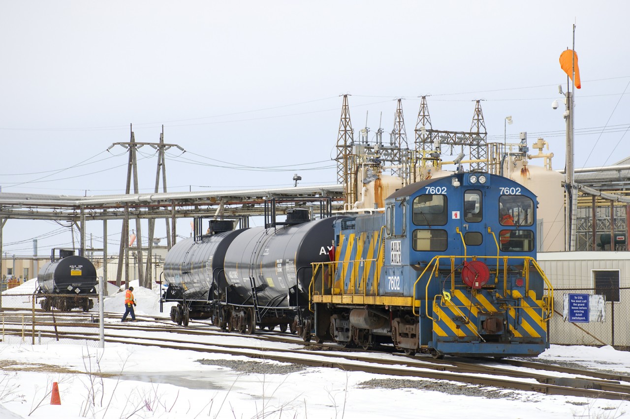 AXLX 7602 does some switching at the Axiall Canada Inc. plant (formerly PPG Standard Chemical) as it moves a couple of tank cars with the same reporting mark as the engine. AXLX 7602 is an SW1001 that was built for the Port of Montreal and still wears those colours.