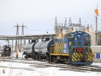 AXLX 7602 does some switching at the Axiall Canada Inc. plant (formerly PPG Standard Chemical) as it moves a couple of tank cars with the same reporting mark as the engine. AXLX 7602 is an SW1001 that was built for the Port of Montreal and still wears those colours.