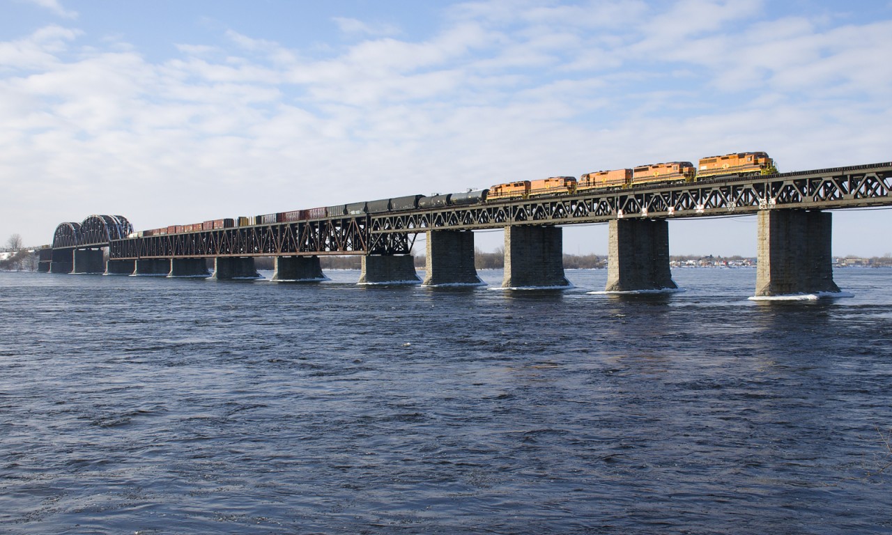 With five orange SLR units for power (SLR 3004, SLR 3804, SLR 804, SLR 805 & SLR 3805), detour train SLR 393 is crossing the St. Lawrence River on CP's bridge linking Montreal with the South Shore.