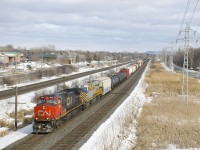 CN 369 had a minor derailment on the Joliette Sub last night, putting a very late CN 369 out of Taschereau a bit past noon. Here it's about to pass MP 14 of the Kingston Sub with IC 2699 & CREX 1515 for power.