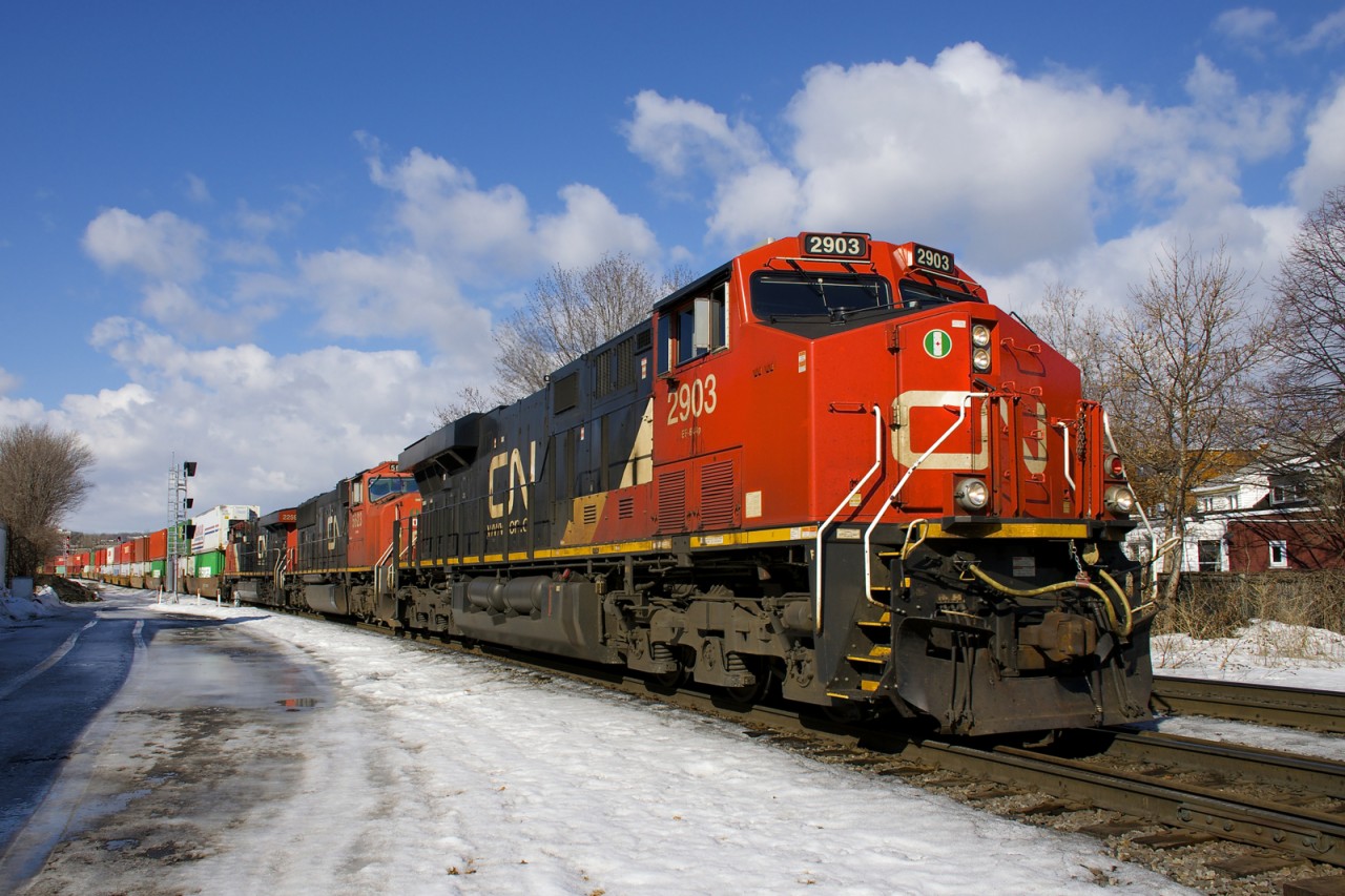 CN 120 approaches the St-Ambroise crossing at MP 3 of CN's Montreal Sub with CN 2903, CN 5623 & CN 2259 up front and DPU CN 2963 and a 576-axle long train.