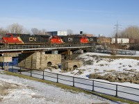 CN 527 with CN 2558, CN 5464 & CN 9584 slowly advances over the Lachine Canal before backing up as it works on its set-off and then lift at Pointe St-Charles Yard. A snowbank gives me some elevation on this spring-like afternoon.