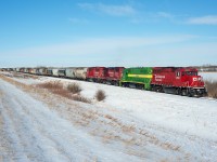 A CP grain peddler makes its way down the Macklin Sub just east of Primate Saskatchewan. Second out in the consist is RTEX 4996 a GP38-3 bound for a crude oil terminal near Kerrobert. 