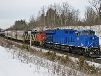 M 32241 11 splits the signals at Mile 30 on the Halton Sub, with a leased GECX locomotive in the lead.  M 322 is an as required, Winnipeg to Battle Creek detour train, which operated across Northern Ontario, as opposed to operating south out of Winnipeg and through Chicago.  Power was: GECX 2033, CN 2405 and CN 8933 was the mid train DP unit.  