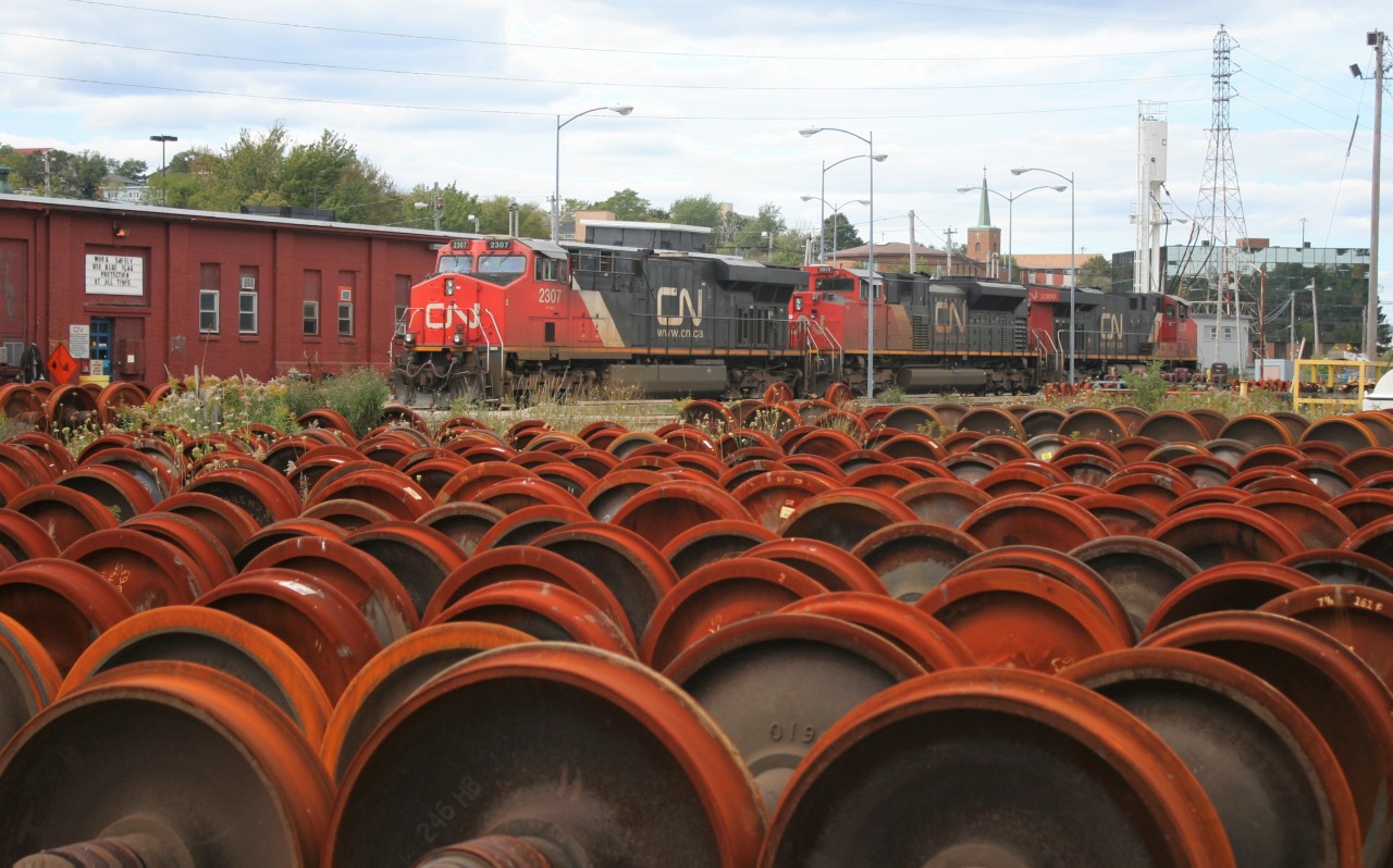 A three-pack of modern six-axle power is seen at laying over at CN’s aging Fairview Shop in Halifax after bringing an eastbound container train into the city. The units include; ES44DC 2307, SD70M-2 8819 and ES44DC 2300.