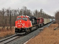 This power has been running up and down the Galt and Hamilton sub for some time now on CP 254 with the CP 8813 leading eastbound and south bound and CP 255 with this CN 3026 leading the return trip north and westward. With the days lengthening and CP 255 running early, the return trip finally came before dark. The light drizzle didn't help me but it did make the colours better.