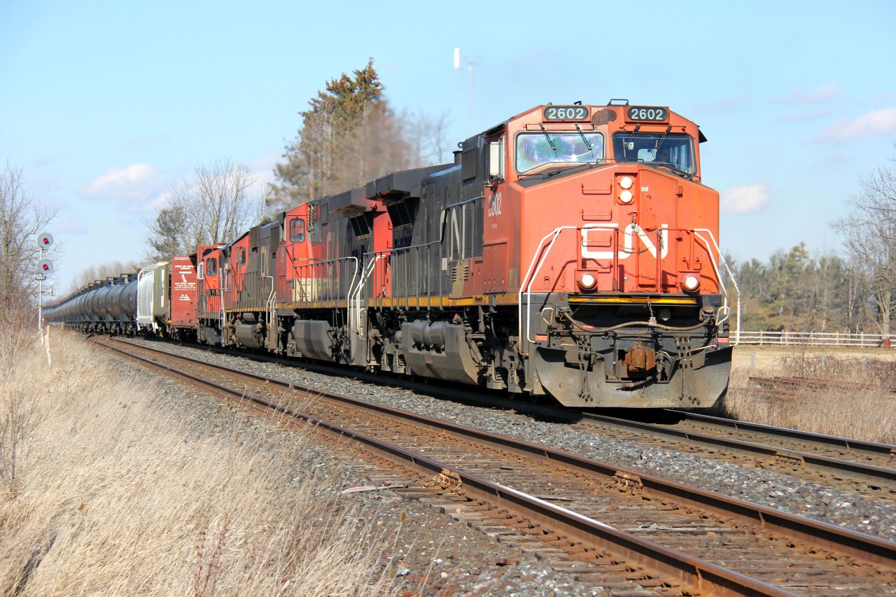 A westbound CN freight storms through Stewarttown, just southwest of Georgetown, on the CN Halton Sub. The signals along the Halton Sub between Burlington and Georgetown are still mainly searchlight signals, so I try to capture images of trains along these portions of mainline. I'm not quite sure of this train symbol, and it was a heavy train, but the power was an aged C44-9W, No. 2602, IC 2699, CN 5445 and CN 4130. Time around 13:50.