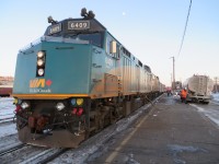 'CANADIAN' CAPREOL CAP UP. Running some 11 hours late out of Toronto on January 28, 2018, gave this rail-fan and his wife the opportunity to witness daylight scenery in Ontario that is viewed by very few if the 'Canadian' had adhered to her previous 2300 Departure the evening before. With the sun setting and the nearly full moon visible above the 6409, VIA RAIL's westbound # 1 stops for her first refuelling in the town of Capreol, ON. This was the first of several refuelling stops, with the next taking place while travelling through the Canadian Shield to Sioux Lookout. En-route to Vancouver and at his wife's suggestion, the train was taken so as to recreate their experience in 1988 in which the photographer proposed to his then girlfriend in the Canadian Rockies.  