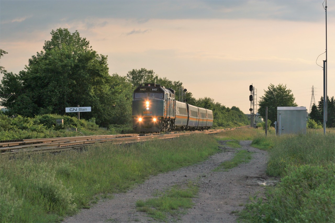 VIA Rail 6427 leads a late evening eastbound train by the Blain crossovers east of Woodstock, Ontario on CN’s Dundas Subdivision.