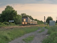 VIA Rail 6427 leads a late evening eastbound train by the Blain crossovers east of Woodstock, Ontario on CN’s Dundas Subdivision. 