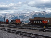 F7Au units 9166 and 9167, as well as SD40 5181, await their call to duty at the CN Jasper roundhouse in the summer of 1975. Note the Jasper auxiliary in the background.