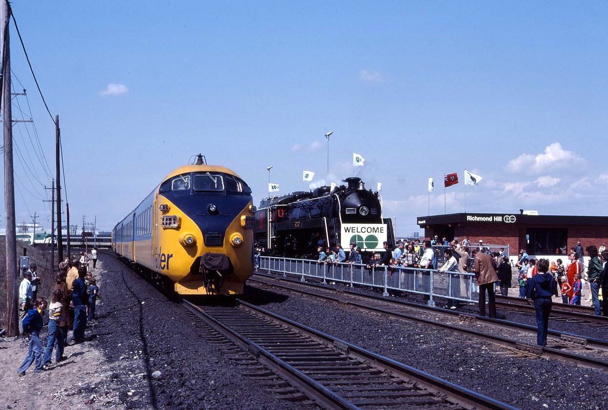My, how times have changed. Look at the number of people who have turned out for the inauguration of GO Train service to Richmond Hill. (Of course, they could be there to see the CN 6060 steam locomotive!) And, despite people all over the right-of-way, Northlander No. 121 creeps by on its way to North Bay and Timmins. Quite the spectacle!