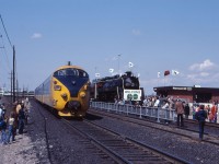 My, how times have changed. Look at the number of people who have turned out for the inauguration of GO Train service to Richmond Hill. (Of course, they could be there to see the CN 6060 steam locomotive!) And, despite people all over the right-of-way, Northlander No. 121 creeps by on its way to North Bay and Timmins. Quite the spectacle!
