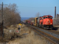 And the second train on a trainless but beautiful Sunday morning, I was fishing for locals in Hamilton since the mainline was so dead and 550 is a guarantee. I arrived *after* 98 to my mistake, but 550 is like shooting fish in a sunny barrel. The crew of 550 works Hamilton Yard and Cargoflo almost without fail, then heads down the Grimsby to work any customers needing a switch between Hamilton and Nelles Rd - today they had a D3R load out of GE in Winona before working Parkdale Yard (Steel Centre) and heading back to Aldershot around the noon hour. In this photo, after working Hamilton yard and zig-zagging from the hot track to the north the boys are enroute to Winona to work. I did not follow, as I had something else en-route, the SOR called DS for a light down into "the hole" so I scurried to the N&NW spur to set up for a photo.