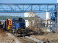 As discussed in my last photo, after shooting <a href=http://www.railpictures.ca/?attachment_id=32055> CN 550 </a> I heard SOR call to head down the N&NW Spur so I set up for a shot I've had in mind for a while. You don't exactly know where the SOR is going to go, for example, they could work the Bunge leads instead, but once I heard "RLK 4001 clear on the approach to Irondale" I knew I made the right choice.<br><br>
Irondale is a curiosity as this location has a long railway history. This location had long ago been a CNR/TH&B interchange point for the Radial and was a stop on the Hamilton Radial Electric Railway. The Hamilton Street Railway also continued to interchange cars here for CNR/TH&B for Firestone until the late 1940's and the name Irondale has stuck to this day as a result. The diamond and signalled crossing is for a CP industrial lead crossing the SOR (CN owned) N&NW spur mainline. For more on Hamilton's interurbans, see this <a href=https://tinyurl.com/ybwtx6y8 target=_blank> Andrew Merrilee's article from approx 1950.</a> <br><br>
After this I went back to see what CP was up to, and they were lifting a loooong cut of cars at NSC - which is usually the last thing they do before heading back to the yard. So I scoped out a shot and found something new to me. Next photo.