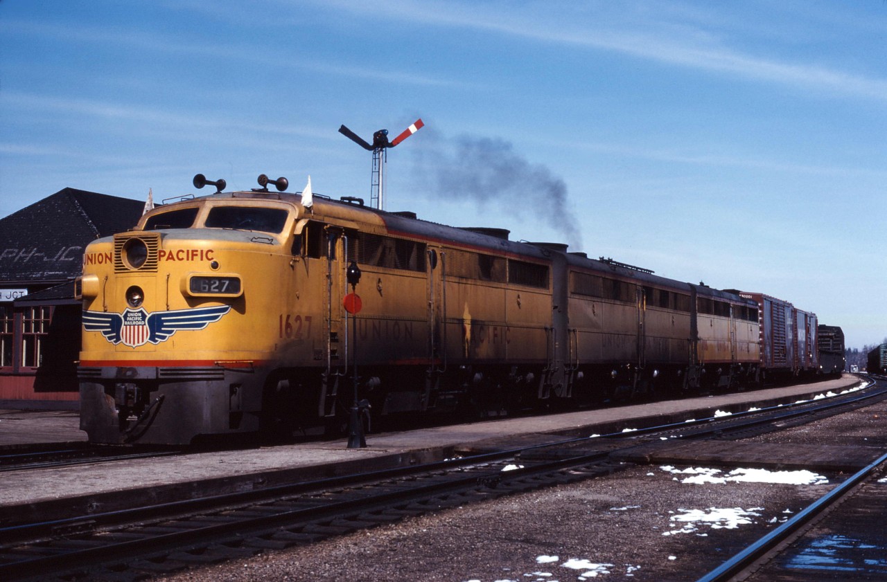 To handle export grain shipments to the Soviet Union, over the 1963-1964 winter CP leased 23 units from U.S. carriers. This included 7 FA1 and 8 FB1 locomotives from Union Pacific (according to the February 1964 issue of Canadian Rail magazine).

Here we see an A-B-B set of the UP units leading a westbound freight through Guelph Jct. Now that's FPON!