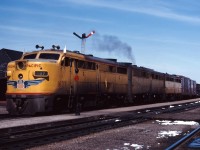 To handle export grain shipments to the Soviet Union, over the 1963-1964 winter CP leased 23 units from U.S. carriers. This included 7 FA1 and 8 FB1 locomotives from Union Pacific (according to the February 1964 issue of Canadian Rail magazine).

Here we see an A-B-B set of the UP units leading a westbound freight through Guelph Jct. Now that's FPON!