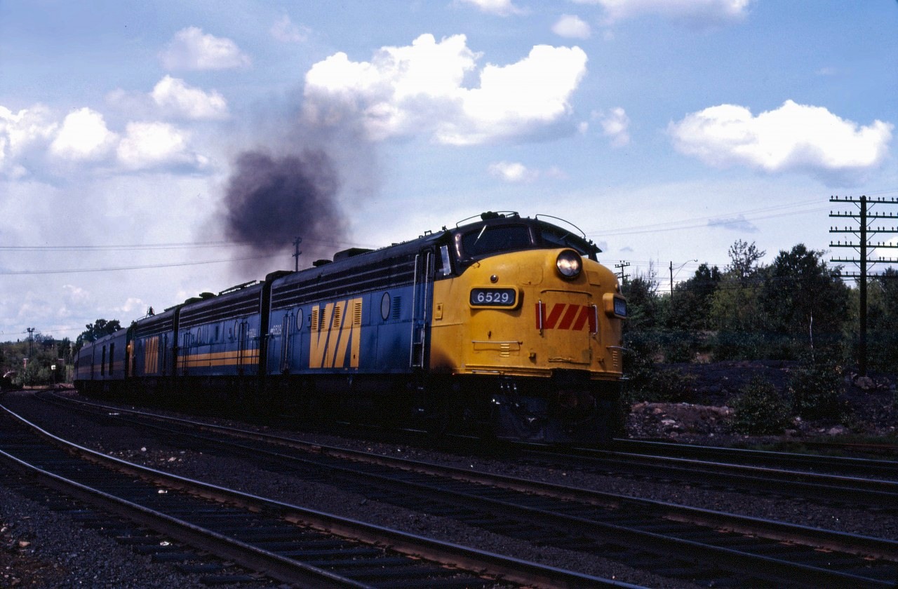 An eastbound VIA departs Sudbury during the summer of 1980. (This appears to be the Super Continental, based on the use of former CN power. Undated--processed in October 1980.)