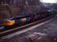 A dreary day at Bayview is brighted by this solid MLW consist--VIA FPA2u 6759, CN RS18 3100, and another RS18 (possibly the 3118). This looks like a Windsor train; likely No. 75, which was due at Bayview at 1607.
